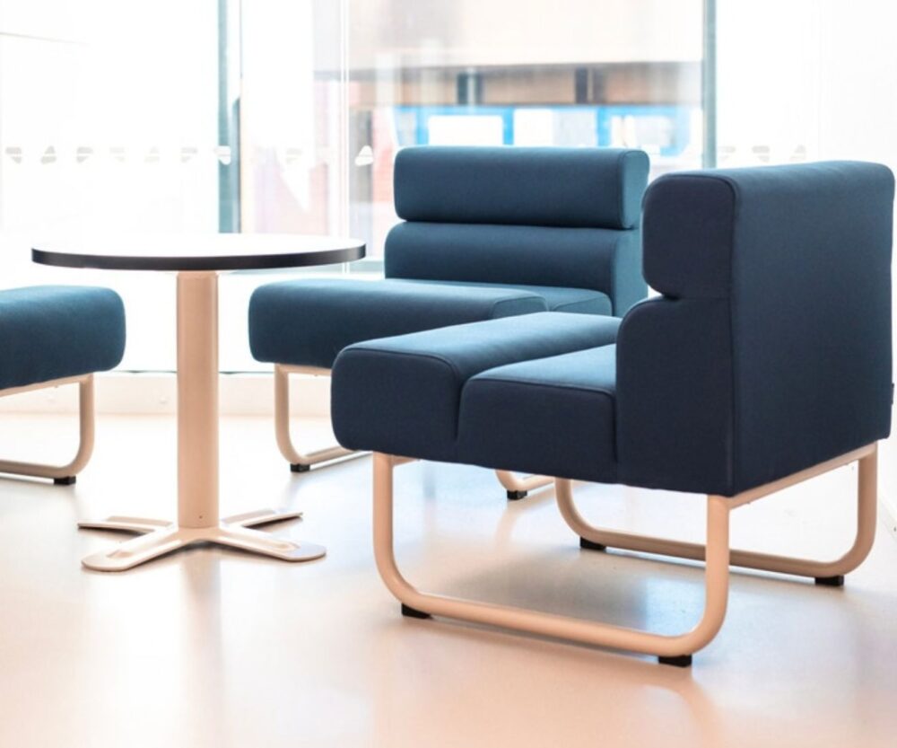 two blue easy chairs and the table