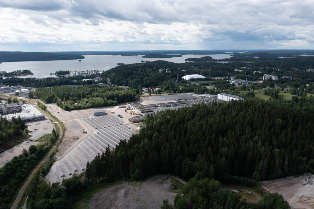 factory image surrounded by forest